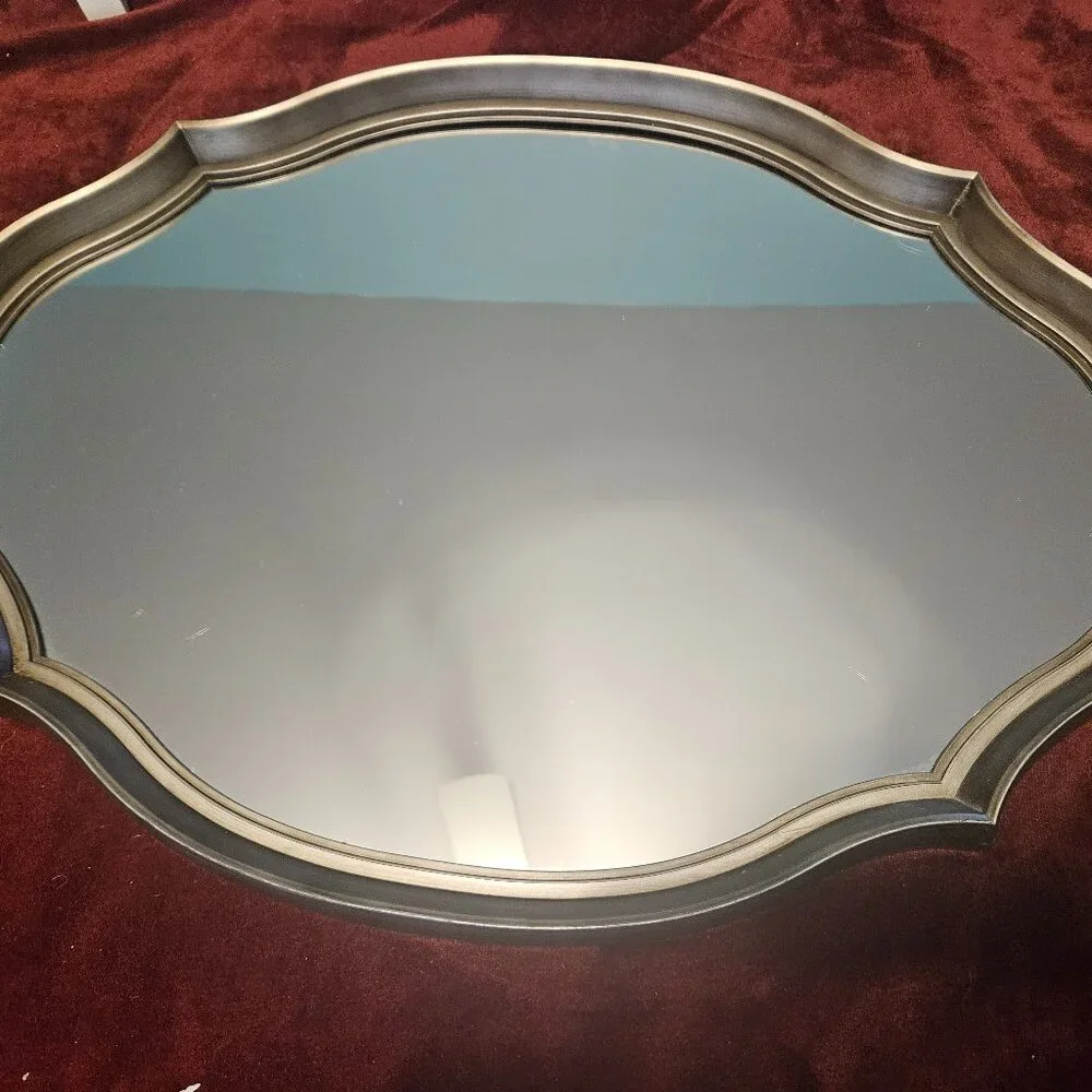 beautiful, scalloped mirror with wire hanger on back